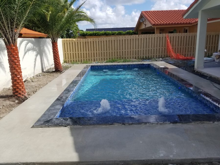 New pool with water jets recently built in Miami by 1 Pool Spa Services