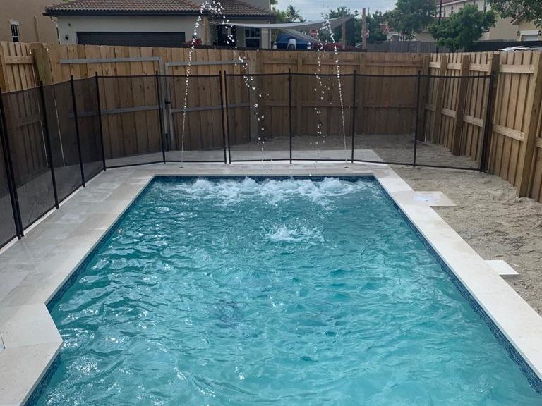 Pool with raised spa and spillover edge in Miami Lakes