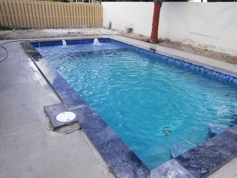 New pool with bubblers and gray marble coping in Westchester