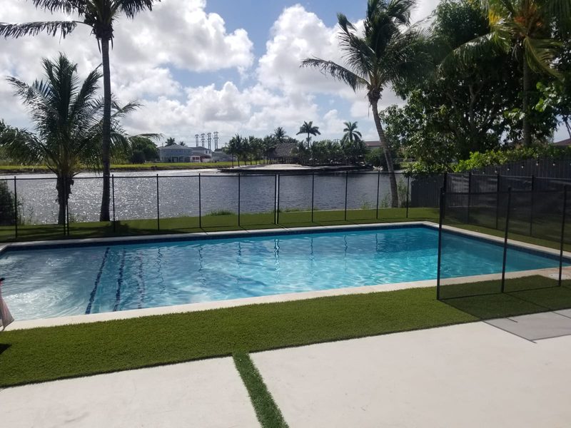 Pool with bubbler jets and mosaic waterline in Miami Lakes