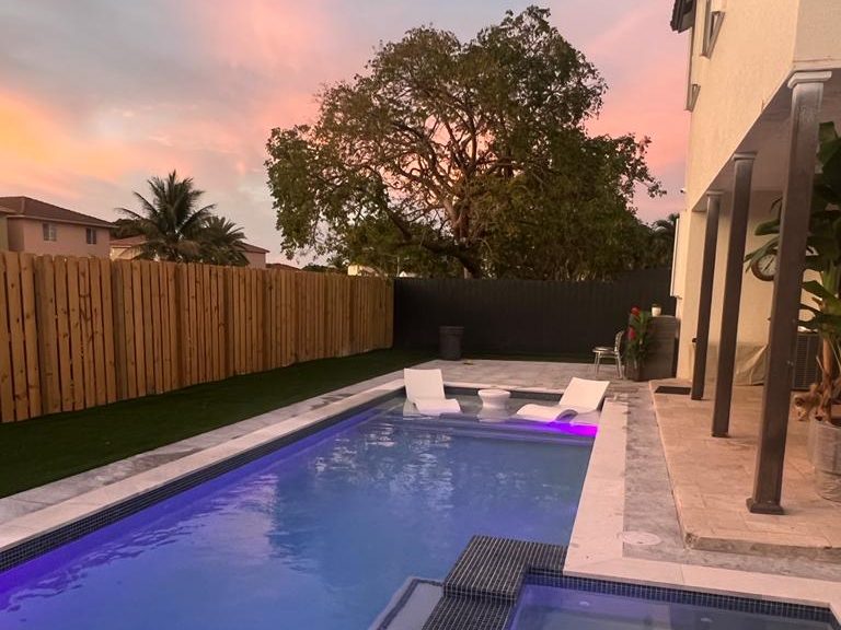 Pool with LED lighting at sunset in Naples